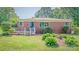 Brick home boasts a tidy front yard and manicured garden beds at 616 26Th Nw St, Hickory, NC 28601
