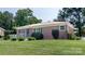 Well-kept brick home featuring lush green lawn and neatly trimmed shrubs at 616 26Th Nw St, Hickory, NC 28601