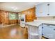 Charming kitchen with wood paneling, bright cabinets, and plenty of counter space for cooking at 616 26Th Nw St, Hickory, NC 28601