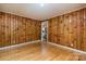 A living room featuring hardwood floors and wood paneling at 616 26Th Nw St, Hickory, NC 28601