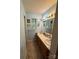 A bathroom with a double sink vanity, medicine cabinet, and blue colored walls at 6300 Fox Hunt Rd, Indian Trail, NC 28079