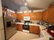 Functional kitchen with oak cabinets, appliances, and ample counter space at 6300 Fox Hunt Rd, Indian Trail, NC 28079