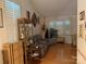 Bright living room with hardwood floors, large windows, and neutral paint at 6300 Fox Hunt Rd, Indian Trail, NC 28079