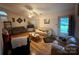 Bright living room featuring hardwood floors, neutral paint, and a ceiling fan at 6300 Fox Hunt Rd, Indian Trail, NC 28079