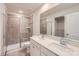 Bathroom features double sink vanity, large mirror, and glass-enclosed shower at 6301 Fairfax Ct, Maiden, NC 28650