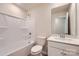 Bathroom features a white vanity, toilet, and tub with shower at 6301 Fairfax Ct, Maiden, NC 28650