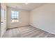 Bedroom featuring a neutral color palette, plush carpeting, and large window at 6301 Fairfax Ct, Maiden, NC 28650