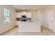 Bright kitchen with white cabinetry, stainless steel appliances, and a center island with sink at 6301 Fairfax Ct, Maiden, NC 28650
