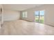 Bright living room with wood floor and sliding glass door leading to the backyard at 6301 Fairfax Ct, Maiden, NC 28650