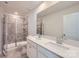Bathroom featuring a double sink vanity, large mirror, and a glass-enclosed walk-in shower at 6337 Fairfax Ct, Maiden, NC 28650