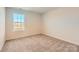 Cozy bedroom with neutral carpet, a bright window, and fresh paint at 6337 Fairfax Ct, Maiden, NC 28650