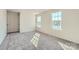 Sunny bedroom with large windows, carpet flooring, and ample natural light at 6337 Fairfax Ct, Maiden, NC 28650