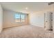 Spacious bedroom with plush carpet, large windows offering plenty of natural light, and ample closet space at 6337 Fairfax Ct, Maiden, NC 28650