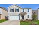 Charming two-story home with a garage, featuring a well-maintained lawn and classic design elements at 6337 Fairfax Ct, Maiden, NC 28650
