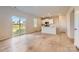 Open-concept kitchen and living room featuring wood floors, white cabinets, and lots of natural light at 6337 Fairfax Ct, Maiden, NC 28650