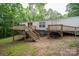 A serene backyard with an elevated deck provides an ideal space for outdoor gatherings and relaxation at 6903 Knottywood Ln # 21, Vale, NC 28168