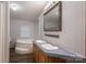 Bathroom featuring a soaking tub, double vanity sinks, and a framed mirror at 6903 Knottywood Ln # 21, Vale, NC 28168