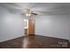 Bright bedroom features wood-look floors, a ceiling fan, and an ensuite bathroom at 6903 Knottywood Ln # 21, Vale, NC 28168