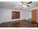 Bedroom featuring wood-look floors, a ceiling fan, and window with blinds at 6903 Knottywood Ln # 21, Vale, NC 28168