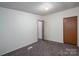 This spacious bedroom includes plush carpets, neutral walls, and ample lighting for a relaxing atmosphere at 6903 Knottywood Ln # 21, Vale, NC 28168