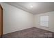 A comfortable carpeted bedroom provides a clean canvas for decorating and a cozy, private retreat at 6903 Knottywood Ln # 21, Vale, NC 28168