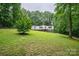 A charming home surrounded by a lush lawn and mature trees provides a peaceful, secluded retreat at 6903 Knottywood Ln # 21, Vale, NC 28168
