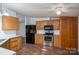 Kitchen with wood cabinets, modern appliances, and a dining bar area at 6903 Knottywood Ln # 21, Vale, NC 28168