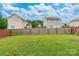 Spacious backyard featuring a lawn surrounded by a wood fence offering privacy at 693 Carybrook Ct, York, SC 29745