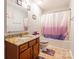 Bathroom with granite-topped vanity and shower-tub combination with matching decor at 693 Carybrook Ct, York, SC 29745
