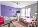 Bedroom with playful purple wall, twin beds, and Paris-themed decor at 693 Carybrook Ct, York, SC 29745
