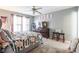 Cozy bedroom with floral bedding, a ceiling fan, and neutral wall color at 693 Carybrook Ct, York, SC 29745