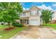 Charming two-story home with a well-manicured front yard and inviting curb appeal at 693 Carybrook Ct, York, SC 29745