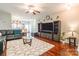 Bright living room featuring hardwood floors, modern furniture, and an open layout at 693 Carybrook Ct, York, SC 29745