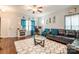 Inviting living room boasts hardwood floors, a plush area rug, and ample seating, perfect for relaxation and entertaining guests at 693 Carybrook Ct, York, SC 29745
