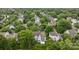 An aerial view of a neighborhood with houses surrounded by lush trees, highlighting the community at 720 Camaross Dr, Charlotte, NC 28270