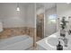Well-lit bathroom featuring a tub, separate glass shower, and a white vanity at 720 Camaross Dr, Charlotte, NC 28270