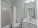 Bathroom features a shower and tub combination with a white toilet and vanity at 720 Camaross Dr, Charlotte, NC 28270