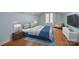 Bedroom showcasing bright natural light, hardwood floors and contemporary furnishings at 720 Camaross Dr, Charlotte, NC 28270