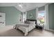 Serene bedroom with a sloped ceiling, neutral tones, and two bright windows at 720 Camaross Dr, Charlotte, NC 28270