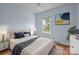 Bedroom with a queen bed, soft carpet, and natural lighting provided by an exterior window at 720 Camaross Dr, Charlotte, NC 28270