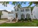 Charming blue two-story home with black shutters, a front lawn, and a welcoming entrance at 720 Camaross Dr, Charlotte, NC 28270