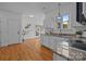 Charming kitchen featuring granite countertops, stainless steel appliances, and hardwood floors at 720 Camaross Dr, Charlotte, NC 28270