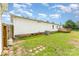 Spacious backyard with a small wooden deck on the rear side of the house at 7990 W Nc 152 Hwy, Mooresville, NC 28115