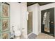 Cozy bathroom area showcasing a toilet, shower, and decorative cabinets at 7990 W Nc 152 Hwy, Mooresville, NC 28115