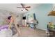 Bright bedroom featuring a play tee-pee, neutral carpet, and a ceiling fan at 7990 W Nc 152 Hwy, Mooresville, NC 28115