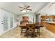 Bright dining room with french doors, a wooden table, and a view into the kitchen at 7990 W Nc 152 Hwy, Mooresville, NC 28115