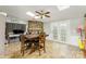 Spacious dining area with a large wooden table, skylights, and access to the backyard at 7990 W Nc 152 Hwy, Mooresville, NC 28115