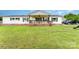 Charming ranch-style home with a welcoming front porch, lush lawn, and classic white siding at 7990 W Nc 152 Hwy, Mooresville, NC 28115