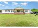 Charming ranch-style home with a welcoming front porch, lush lawn, and classic white siding at 7990 W Nc 152 Hwy, Mooresville, NC 28115