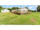Expansive wooden deck offering ample space for outdoor enjoyment, set against a backdrop of a green yard at 7990 W Nc 152 Hwy, Mooresville, NC 28115